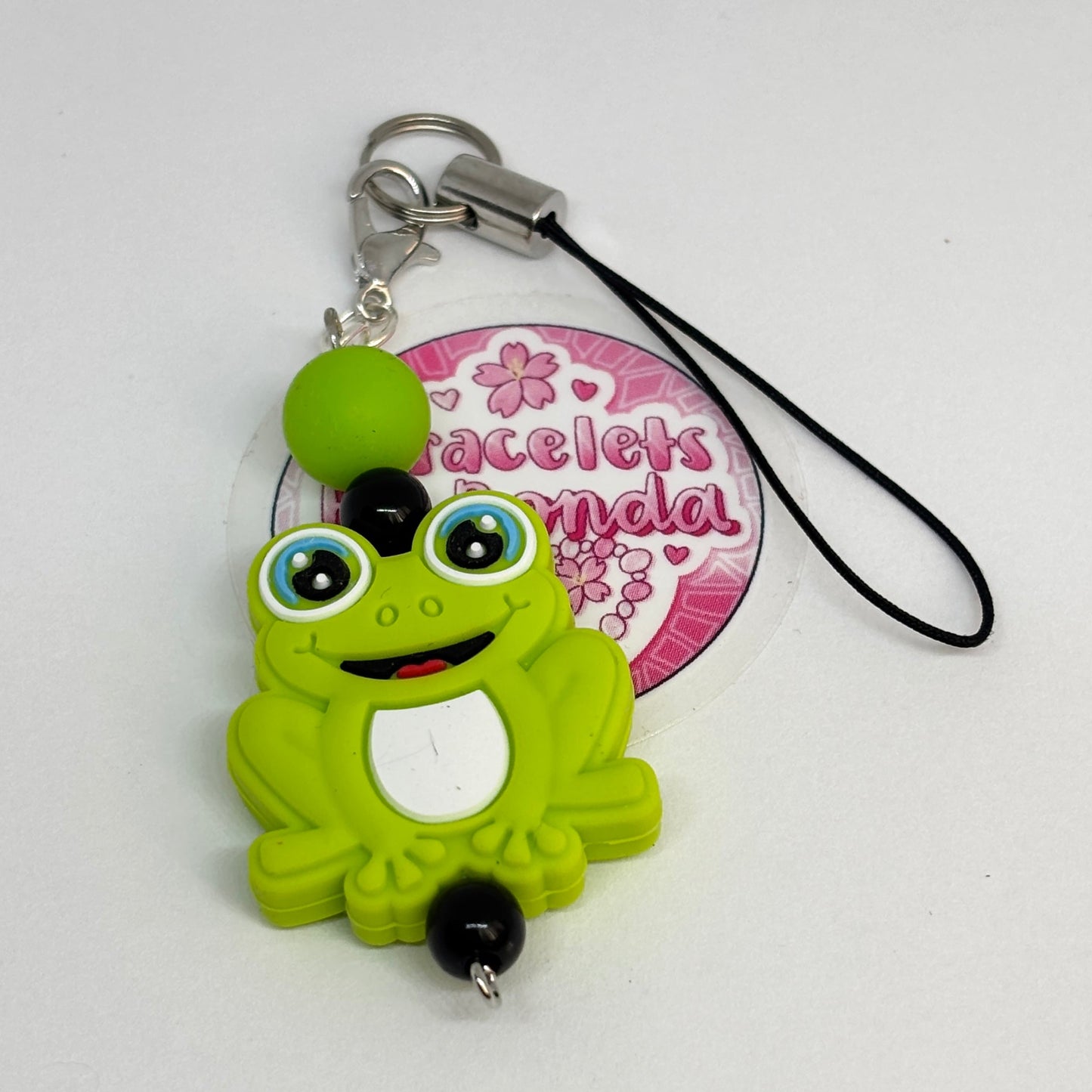 Smiley frog bag charm.