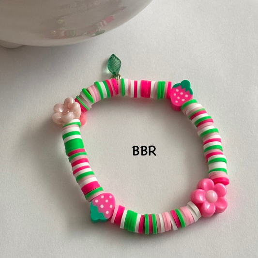 Handmade heishi clay bead bracelet with flower and strawberry beads. 